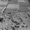 Oblique aerial view centred on the hospital, taken from the SE.