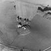 Oblique aerial view of Kildrummy, St Bride's Chapel and Well centred on the chapel with a possible motte and churchyard adjacent, taken from the S.
