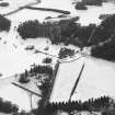 Oblique aerial view of country house taken from the NE.