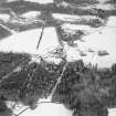 Oblique aerial view of country house taken from the SW.