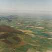 General oblique aerial view of landscape of the Garioch looking towards the village Kennethmont from the area of Tap o' Noth hillfort, taken from the W.