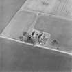 Oblique aerial view centred on the farmstead, taken from the WNW.