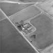 Oblique aerial view centred on the farmstead, taken from the WSW.
