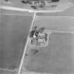 Oblique aerial view centred on the farmstead, taken from the SW.