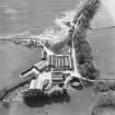 Oblique aerial view centred on the farmstead, taken from the E.