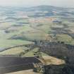 General oblique aerial view looking across the Howe of Alford down the River Don towards Cairn William, taken from the W.