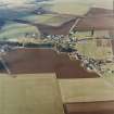 Oblique aerial view centred on the village, taken from the SSE.