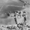 Oblique aerial view of the manse with the church adjacent, taken from the WNW