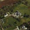 Oblique aerial view centred on the hospital and house, taken from the WSW.