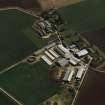 Oblique aerial view centred on the village and farmsteadings, taken from the NW.