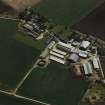 Oblique aerial view centred on the village and farmsteadings, taken from the NNW.