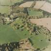 Oblique aerial view of the country house, farmsteading and walled garden, taken from the S.