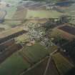 General oblique aerial view centred on Monymusk village, taken from the SSW.