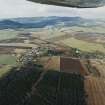 General oblique aerial view looking across Monymusk village towards Bennachie, taken from the SSE.