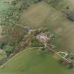 Oblique aerial view centred on the Home Farm with the ruins of the Country House adjacent, taken from the SE.