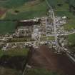 Oblique aerial view of Rhynie centred on the church, taken from the SW.
