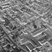 Oblique aerial view centred on the college with the church adjacent, taken from the S.