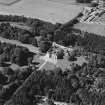Oblique aerial view centred on the country house, taken from the ESE.