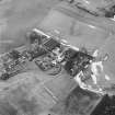 Oblique aerial view centred on the whisky distillery, taken from the ENE.