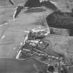 Oblique aerial view centred on the whisky distillery, taken from the S.