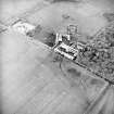 Oblique aerial view centred on the farmsteading, taken from the S