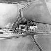 Oblique aerial view of the church, churchyard and farmstead, taken from the S.