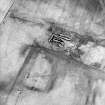 Oblique aerial view centered on the remains of the farmstead, taken from the SE.