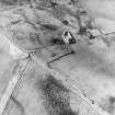 Oblique aerial view centred on the farmsteading, taken from the NNE.