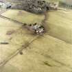 Oblique aerial view centred on the farmsteading with the country house adjacent, taken from the NW.