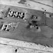 Oblique aerial view centred on the remains of the bomb store, taken from the SSW.