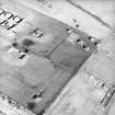 Oblique aerial view centred on the remains of the bomb store, taken from the SSE.