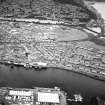 General oblique aerial view of the town, centred on the quays and brewery, taken from the NE.