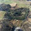 Oblique aerial view centred on the lodge and gardens, taken from the E.