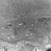 Aerial view of North Sutor, First World War (QF) quick-firing 4-inch gun battery from the S.  Visible are the four gun-emplacments, magazines and other structures.