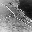 Aerial view of Nigg Second World War coast battery and accommodation camp from the NW.  The two partly demolished gun-emplacements are visible. One of the gun-emplacements has been built into the remains of Dunskeath Castle.