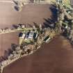 Oblique aerial view centred on the farmsteading, taken from the SW.