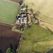 Oblique aerial view centred on the farmsteading, taken from the SSW.