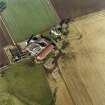 Oblique aerial view centred on the farmsteading, taken from the SSE.