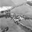 Oblique aerial view centred on the farmsteading, taken from the N.