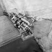 Oblique aerial view centred on the farmsteading, taken from the WSW.