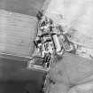 Oblique aerial view centred on the farmsteading, taken from the SSW.