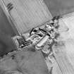 Oblique aerial view centred on the farmsteading, taken from the SE.