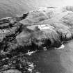 Oblique aerial view centred on the lighthouse, taken from the WNW.