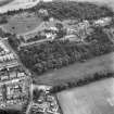 Oblique aerial view centred on Craig House, Old Craig House, South Craig Villa, Bevan House, East Craig and Queen's Craig