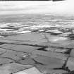 Oblique aerial view of Kirknewton Airfield centred on the airfield, taken from the SE.