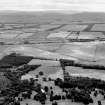 Oblique aerial view of Kirknewton Airfield centred on the airfield, taken from the NW.