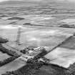 Oblique aerial view of Kirknewton Airfield centred on the airfield, taken from the WNW.