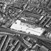 Oblique aerial view of Edinburgh centred on the construction of the Fountain Park Leisure Centre, taken from the WNW.