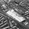 Oblique aerial view of Edinburgh centred on the construction of the Fountain Park Leisure Centre, taken from the W.