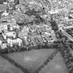 Oblique aerial view centred on the hospital with the school adjacent, taken from the S.